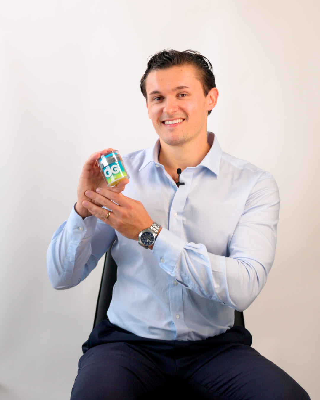 Michael, co-founder of Original Glow, holding Active Restore Cream