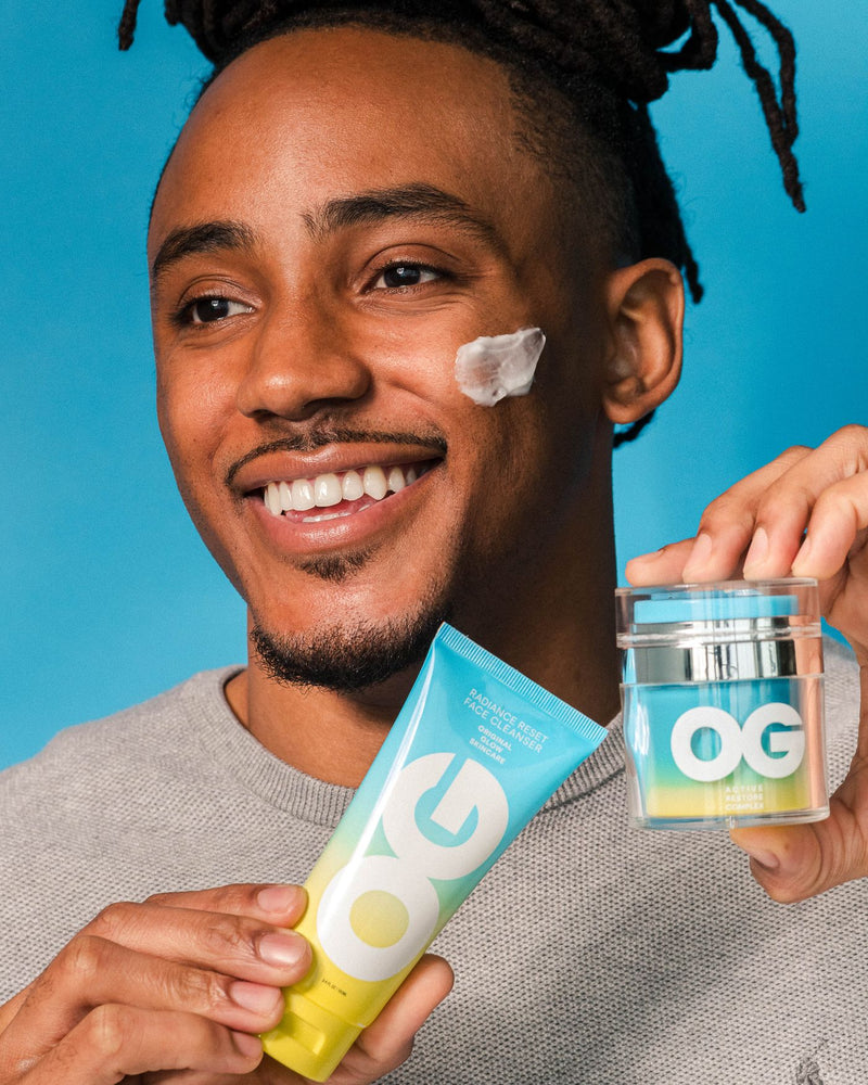 Man holding Reset Face Cleanser and Active Restore Cream